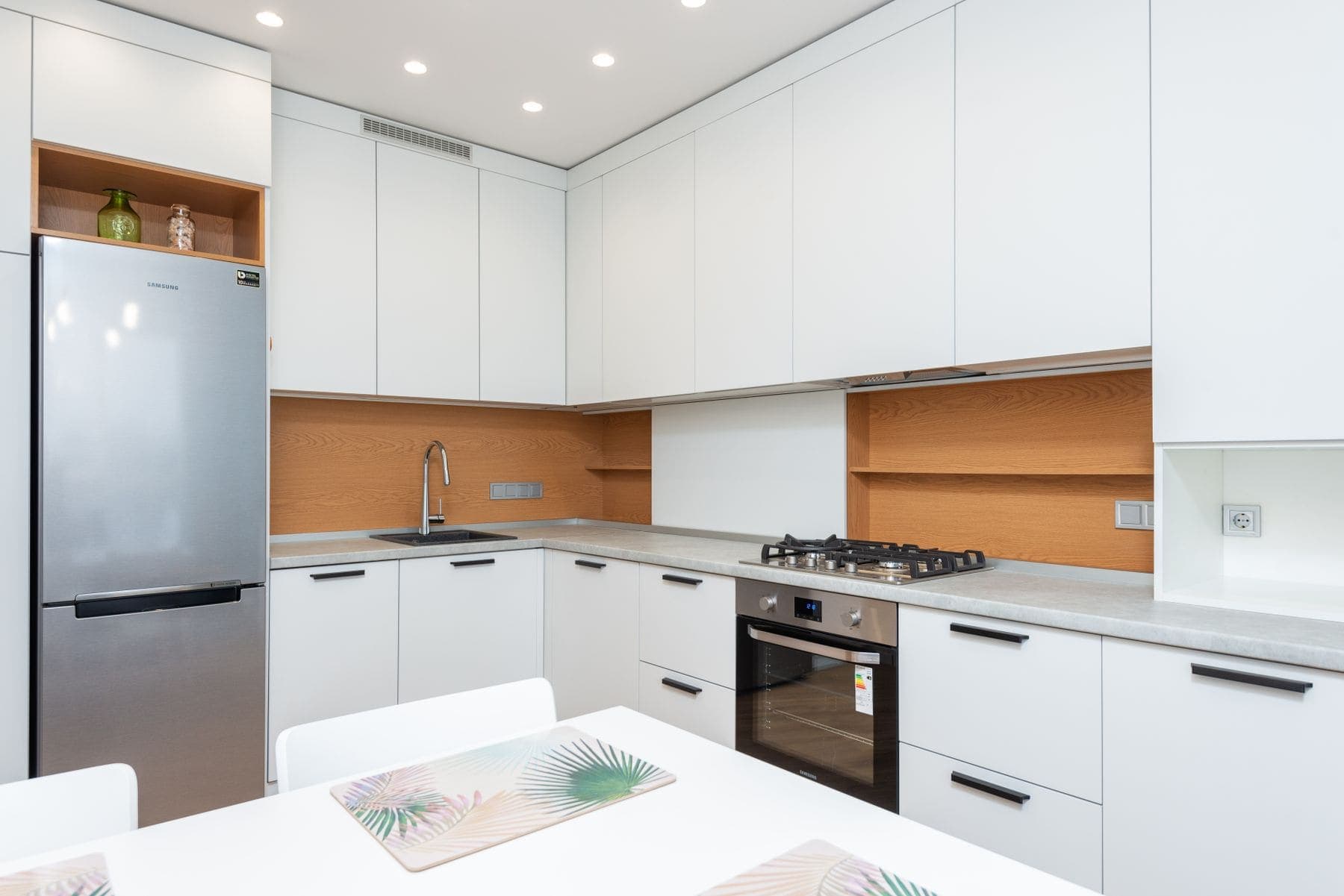 Well-maintained painted kitchen cabinetry