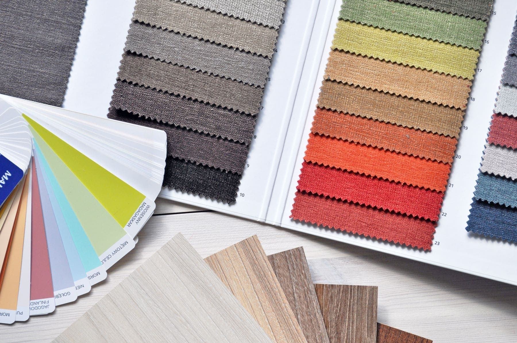 Mood board of paint colours, fabrics and timber samples