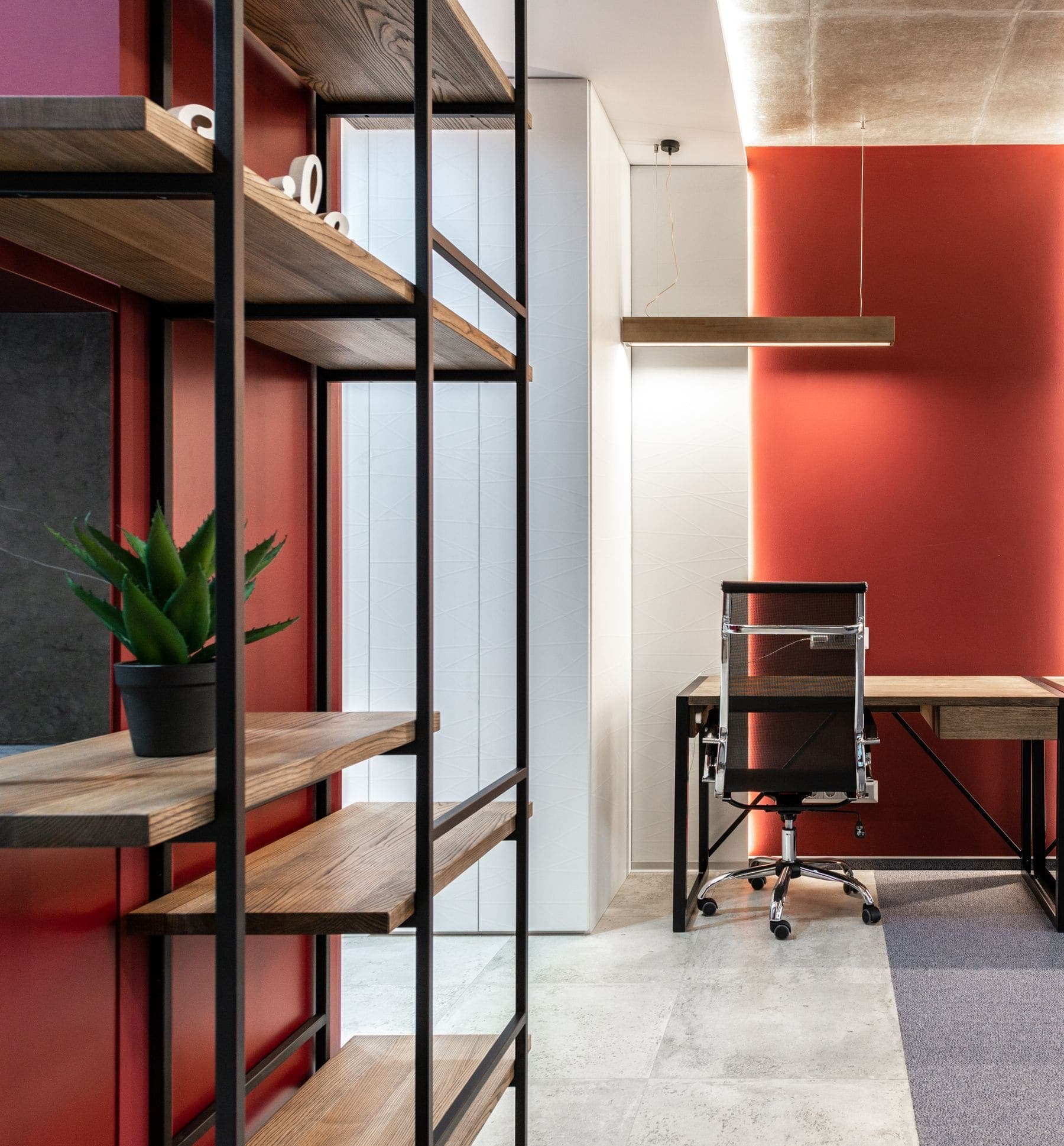 Open-plan office with a bold painted accent wall
