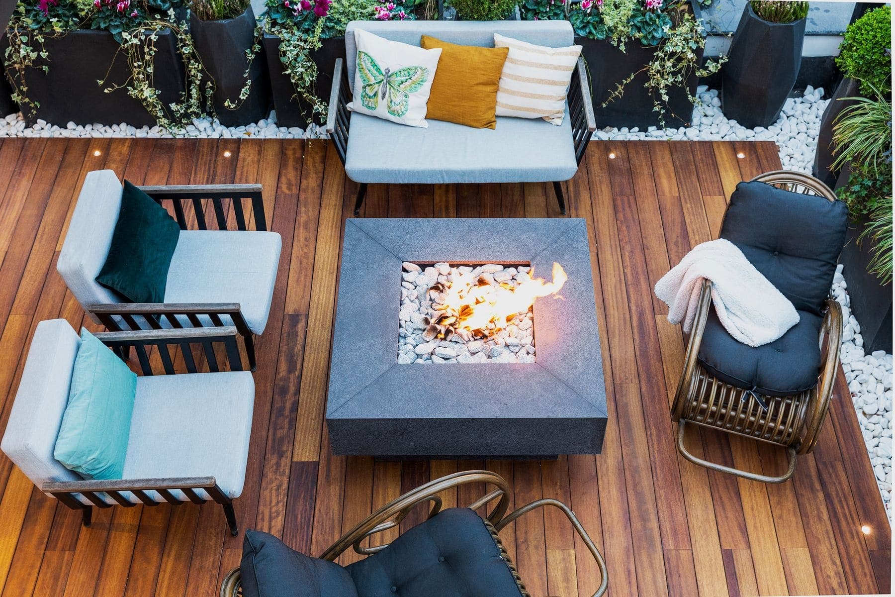 Freshly stained timber deck with outdoor seating