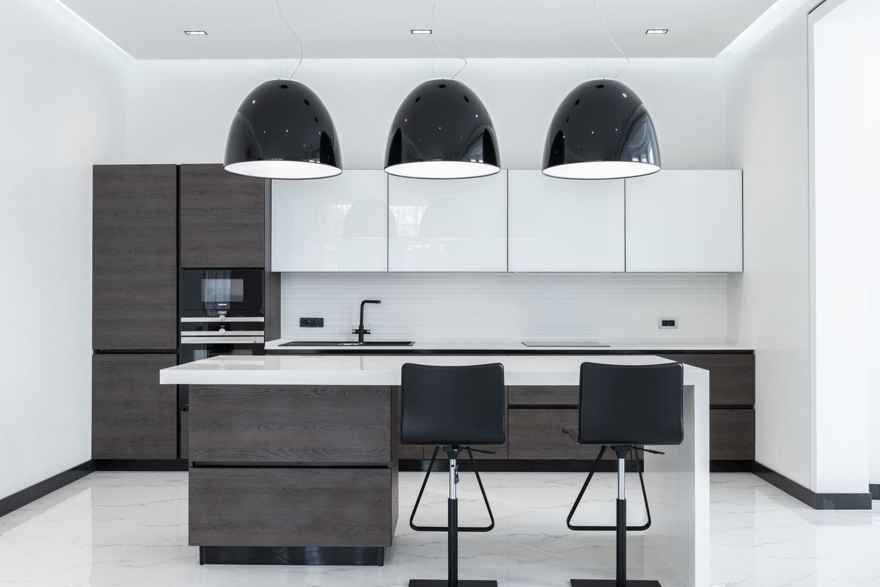 Cabinet Painting by Brivon — Kitchen island with freshly painted cabinetry and bar stools