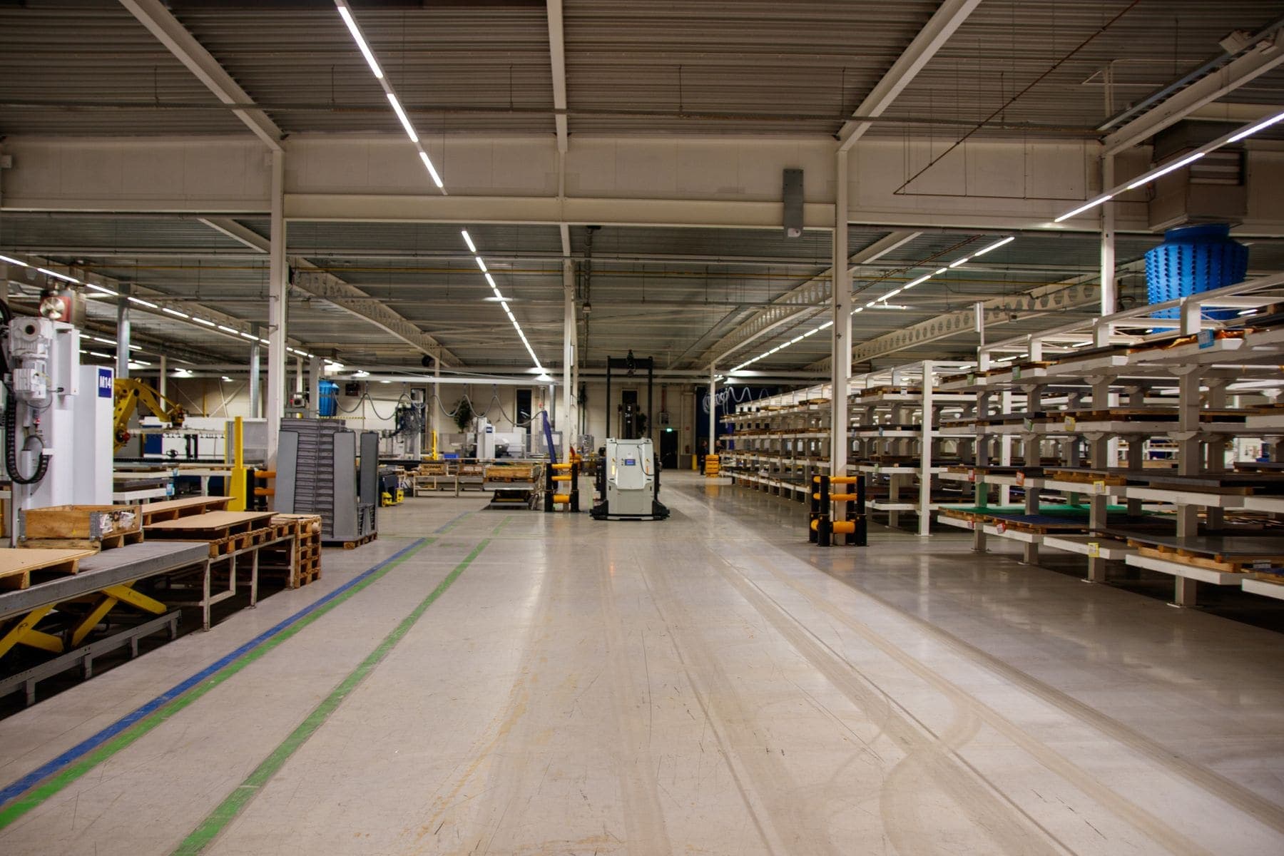 Clean warehouse interior with coated walls and floor markings